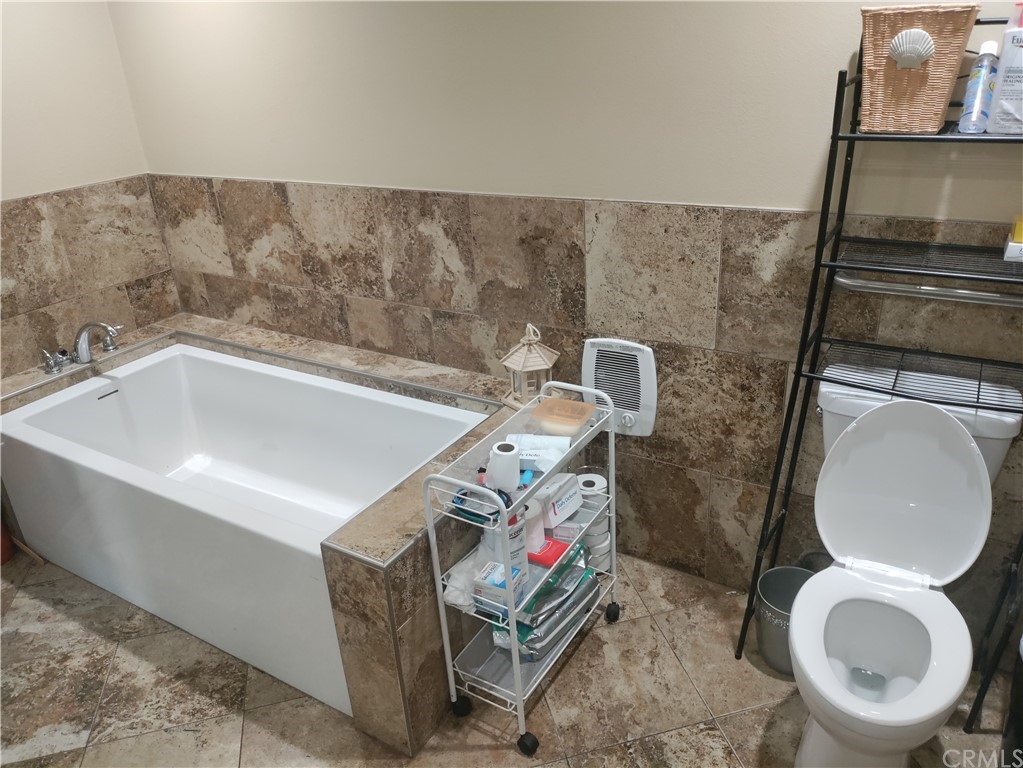 24510 Pace Drive Moreno Valley, CA 92557 - Photo 7 of 13 a bathroom with a toilet and a sink