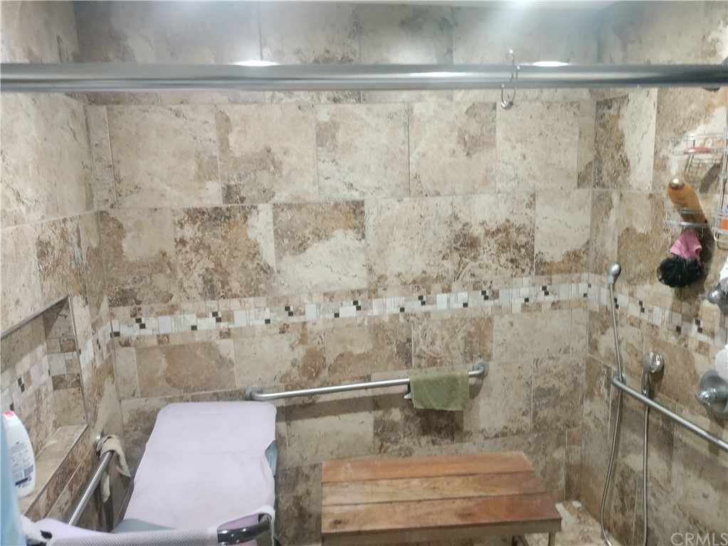 24510 Pace Drive Moreno Valley, CA 92557 - Photo 8 of 13 a bathroom with a shower