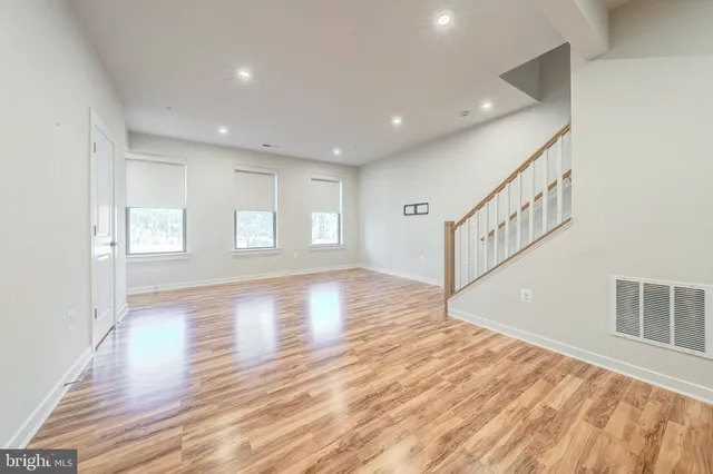 a view of an entryway with wooden floor