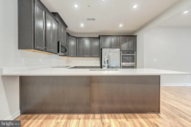 a view of a kitchen with a sink