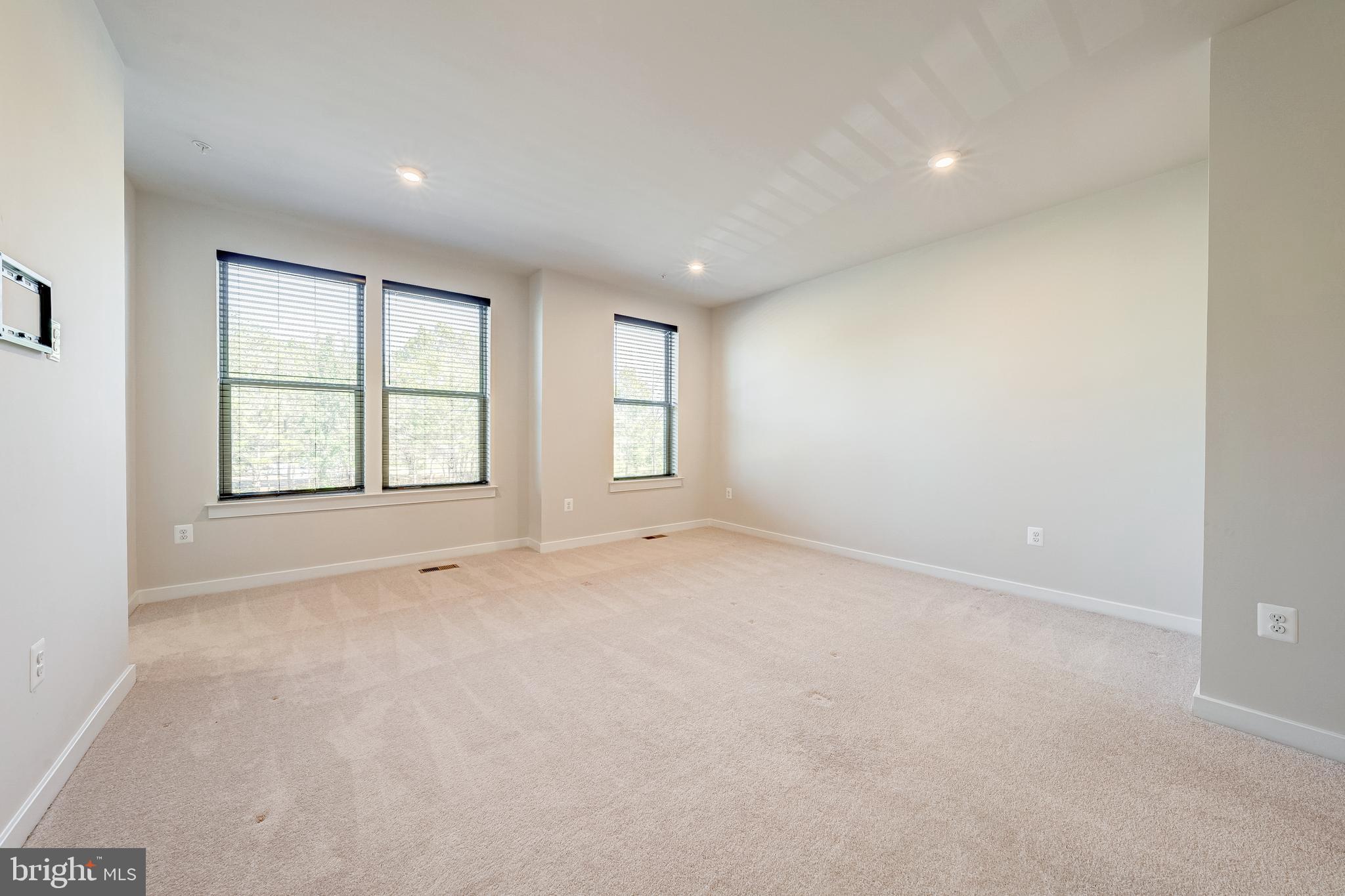13504 Innovation Station Loop, Unit 2A Herndon, VA 20171 - Photo 23 of 36 an empty room with windows