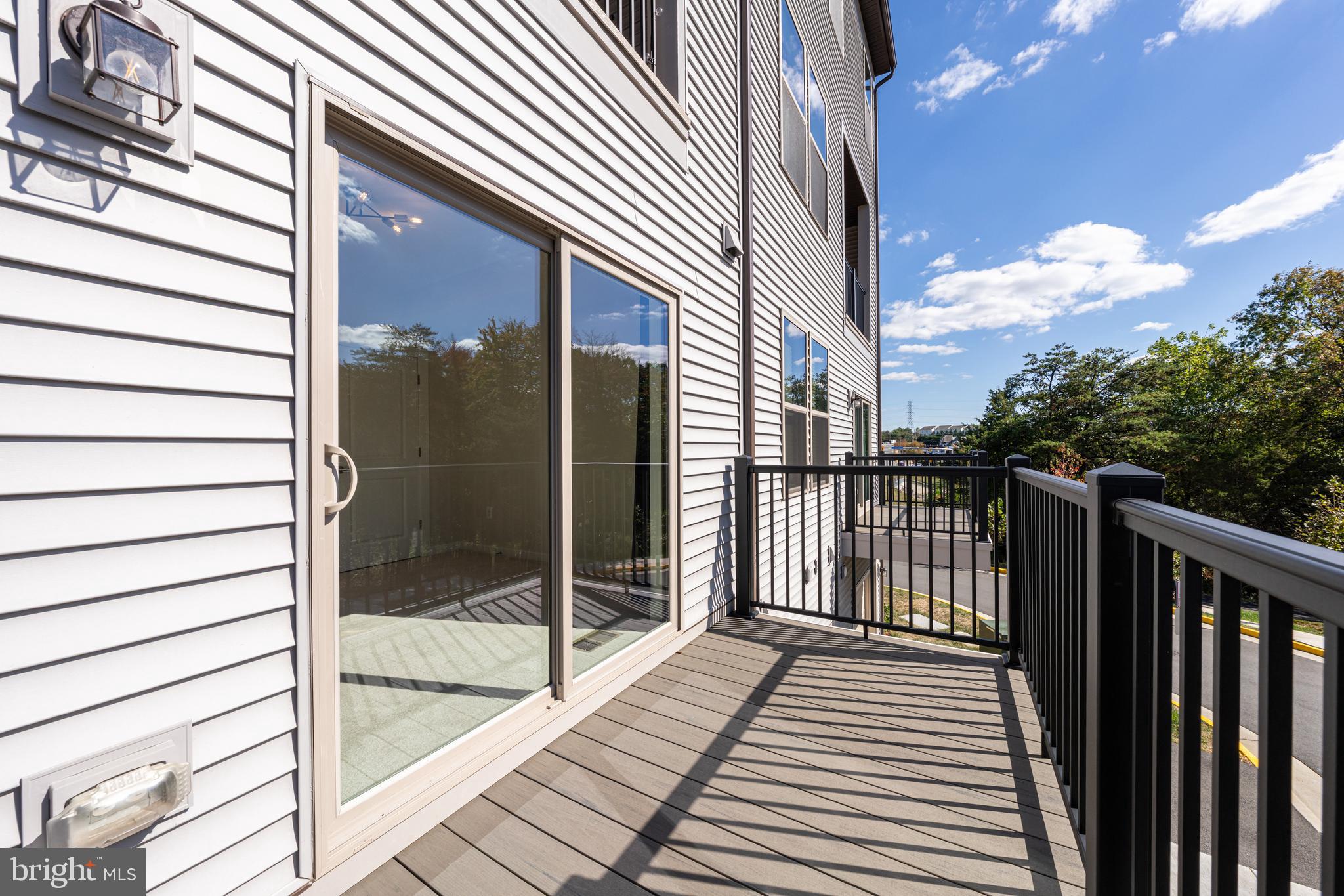 13504 Innovation Station Loop, Unit 2A Herndon, VA 20171 - Photo 36 of 36 a view of a balcony with wooden floor