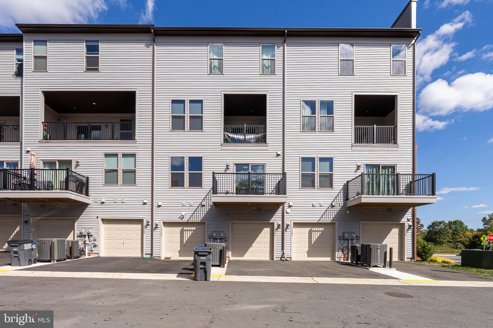 13504 Innovation Station Loop, Unit 2A Herndon, VA 20171 - Photo 4 of 36 a view of a building with car windows