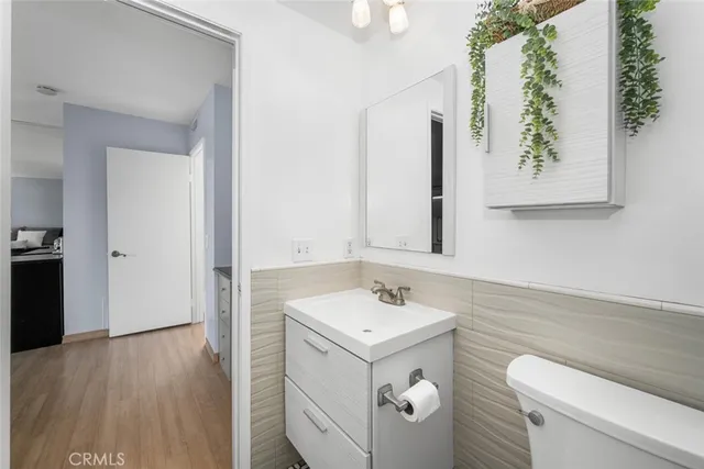 a bedroom with a large bed and a large window