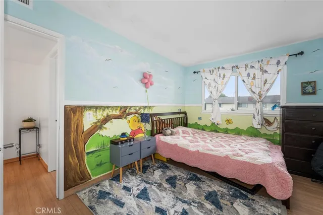 a bedroom with furniture and a bed