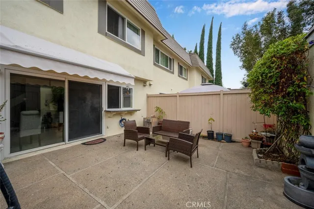 a couple of chairs in front of building