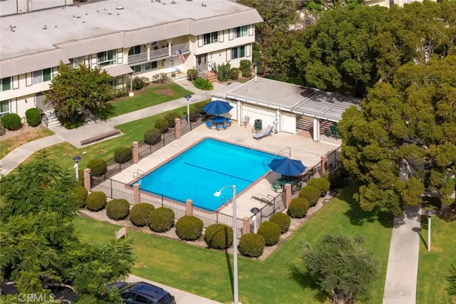 a view of a white building with many windows