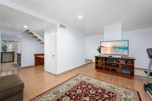 a living room with furniture and a rug