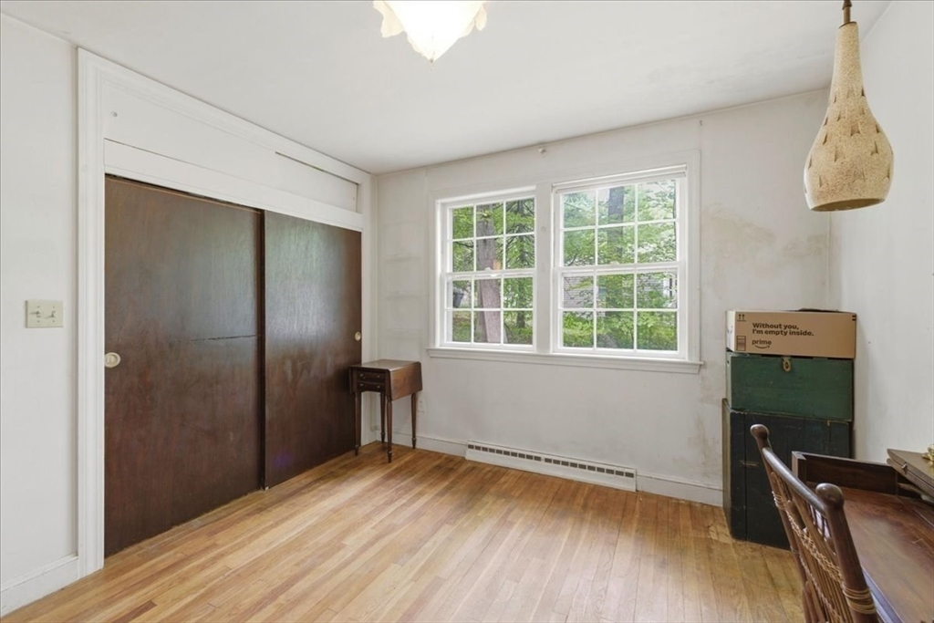 99 Brook Road Sharon, MA 02067 - Photo 21 of 37 a view of room with window and wooden floor