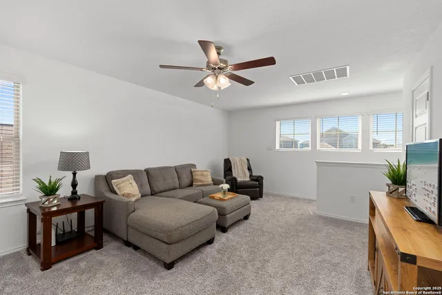 a living room with furniture and a window