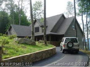 a view of a car park in front of a house