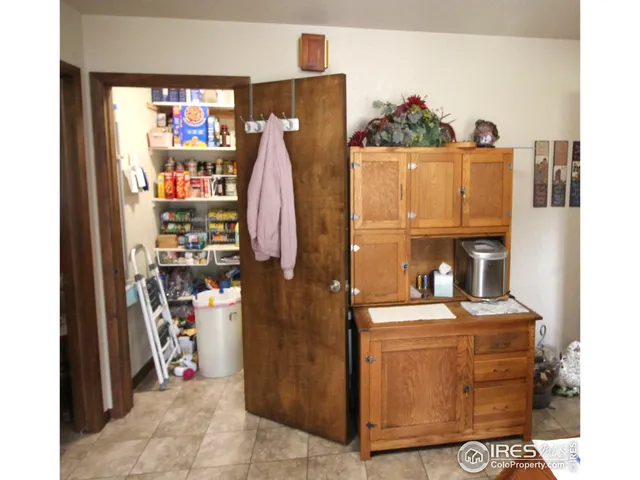 a bathroom with a sink a mirror a vanity and a shower