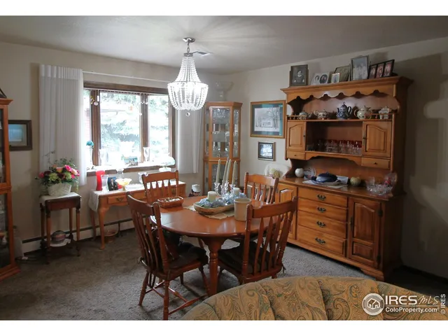 a kitchen with stainless steel appliances granite countertop a refrigerator a stove and a sink