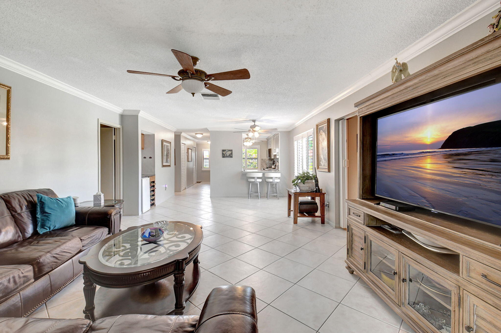 21214 Lago Circle, Unit B Boca Raton, FL 33433 - Photo 12 of 48 a living room with furniture and a flat screen tv