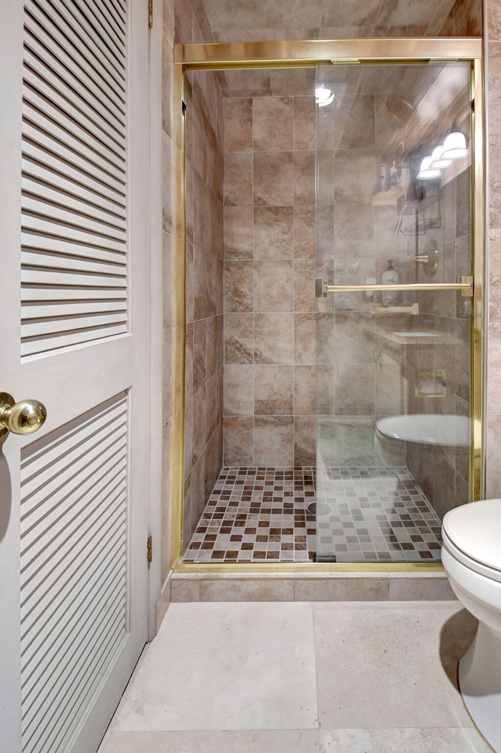21214 Lago Circle, Unit B Boca Raton, FL 33433 - Photo 23 of 48 a bathroom with a shower