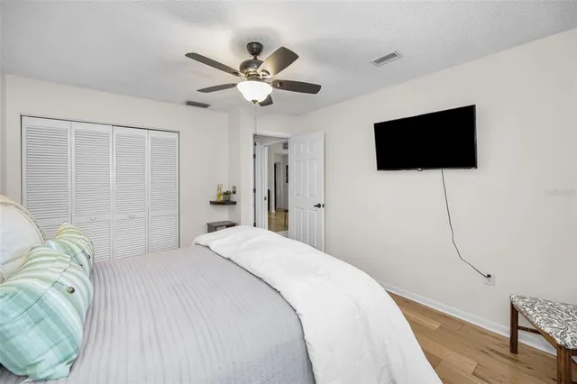 a view of a field with trees in background