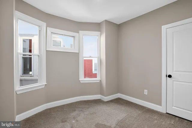 an empty room with windows