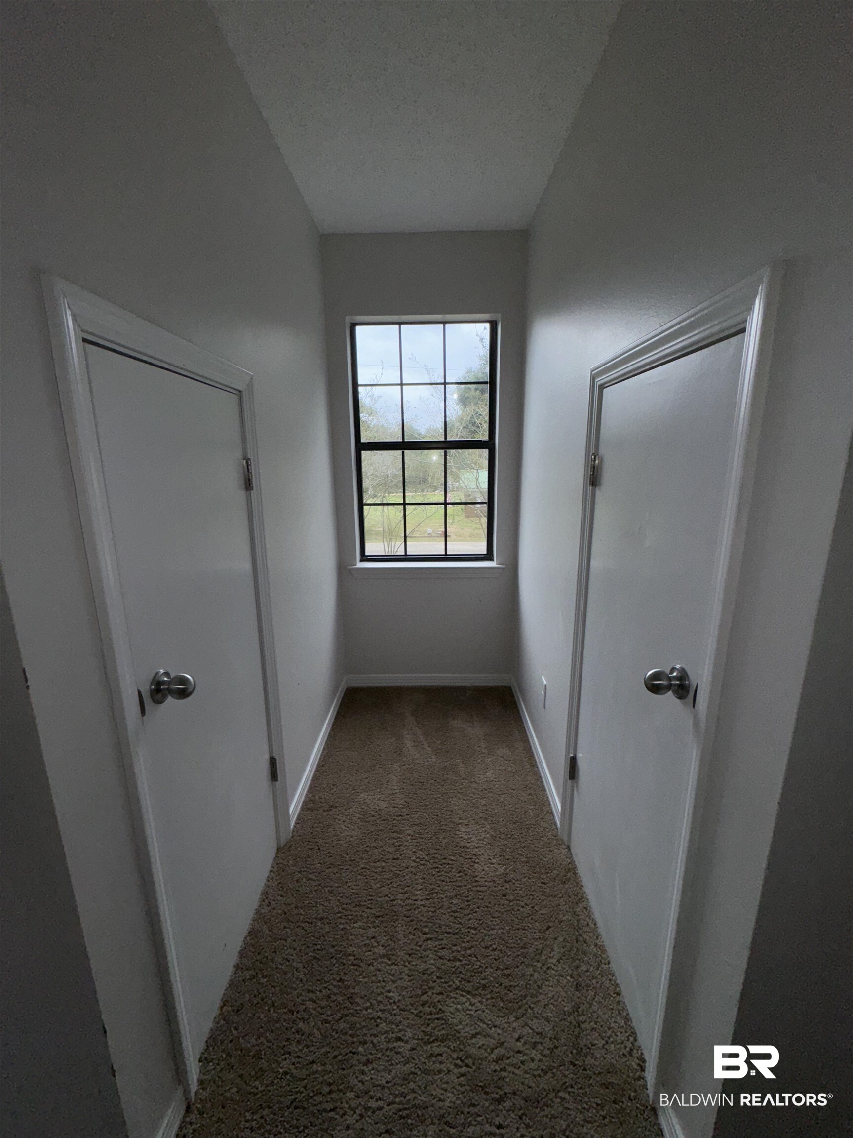 70 Plum Street Uriah, AL 36480 - Photo 25 of 36 Hall featuring a textured ceiling and carpet floors