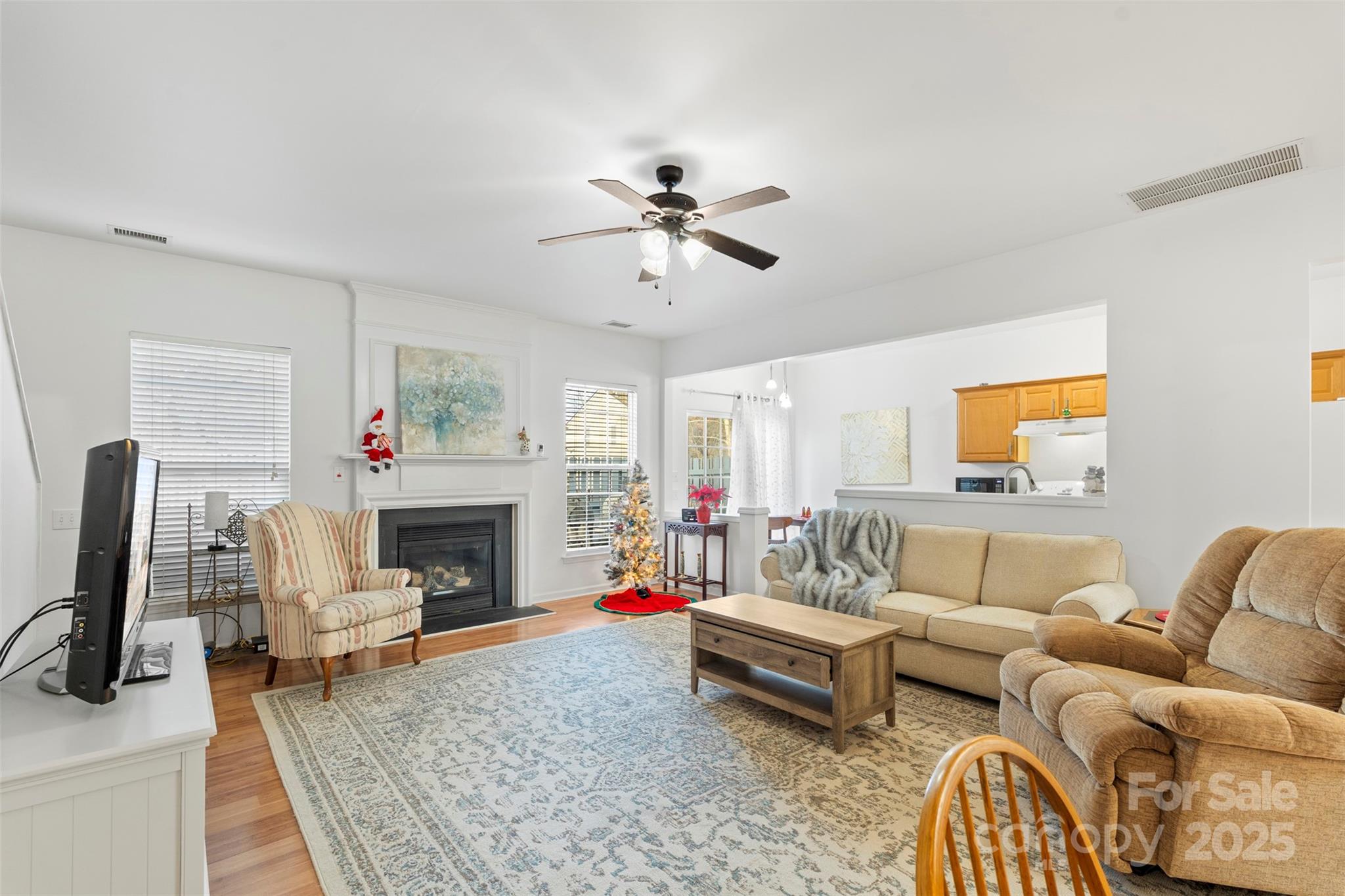 11730 Huxley Road Charlotte, NC 28277 - Photo 13 of 37 a living room with furniture and a fireplace