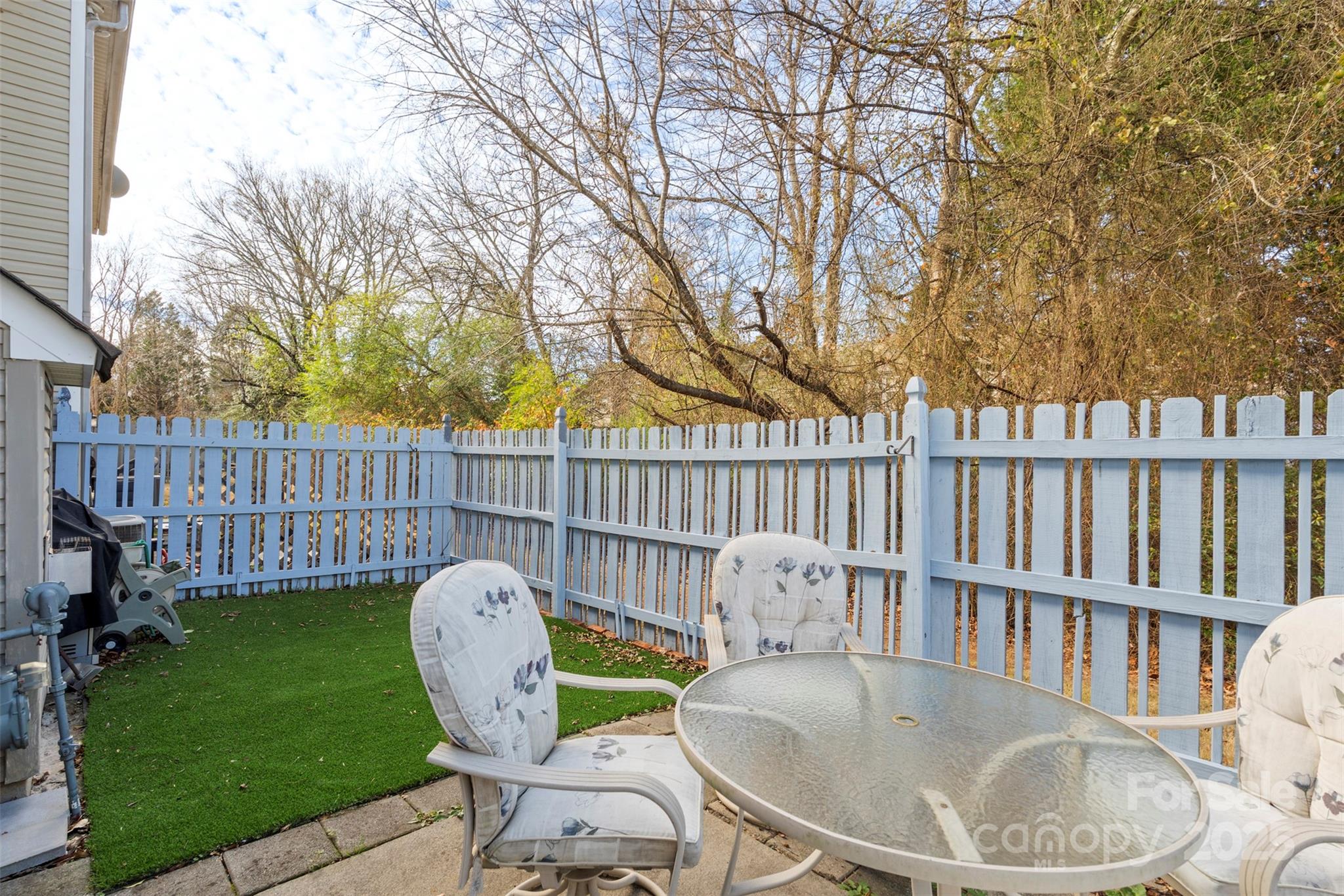 11730 Huxley Road Charlotte, NC 28277 - Photo 21 of 37 a view of a chair and table in backyard