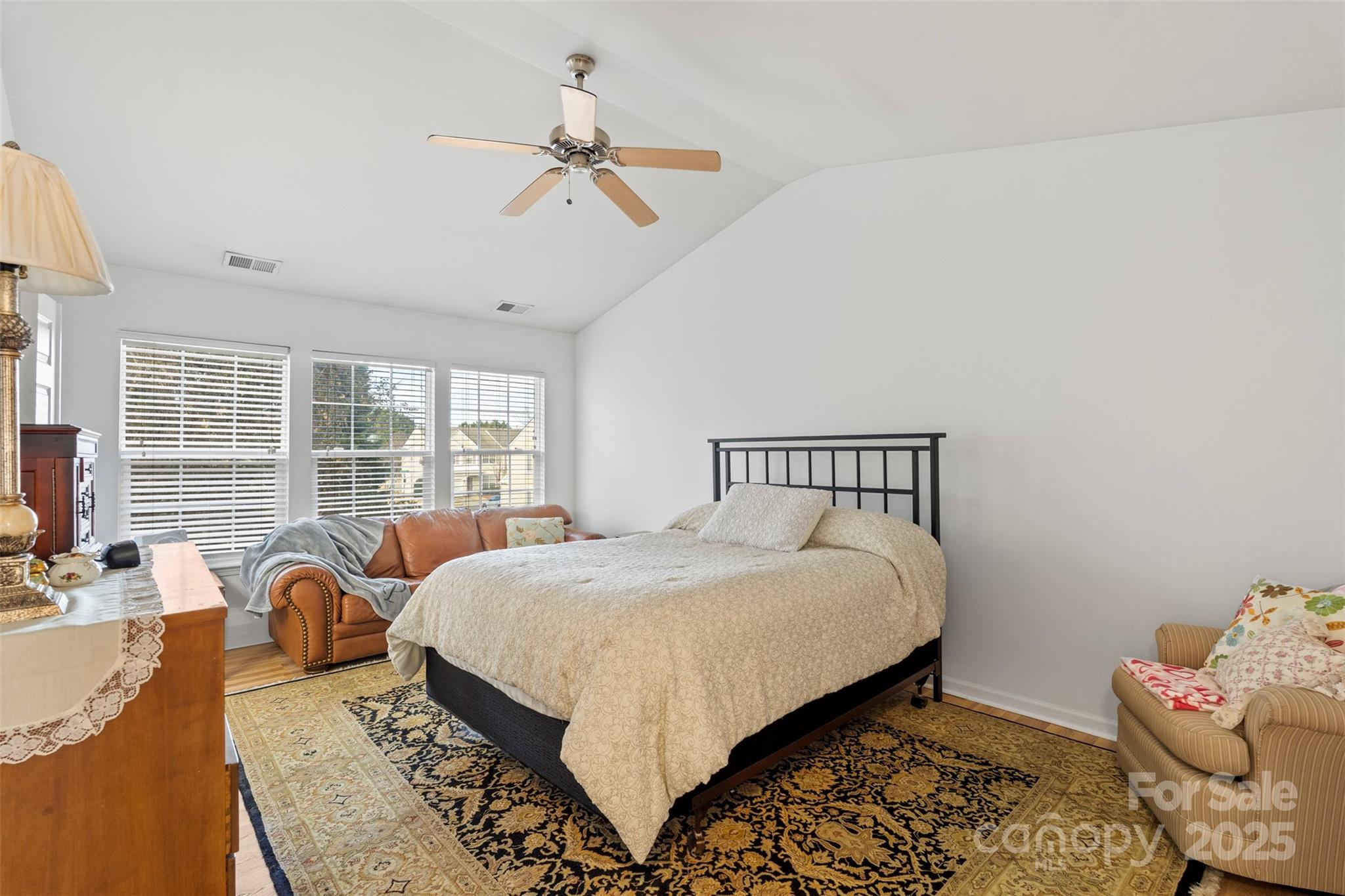 11730 Huxley Road Charlotte, NC 28277 - Photo 25 of 37 a bed room with a bed and a couch