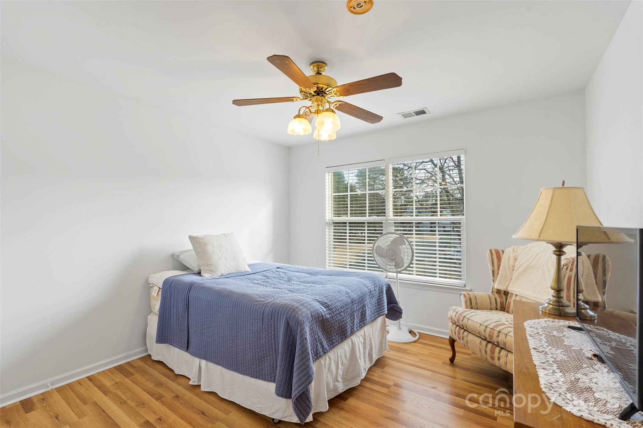 11730 Huxley Road Charlotte, NC 28277 - Photo 32 of 37 a bedroom with a bed and window