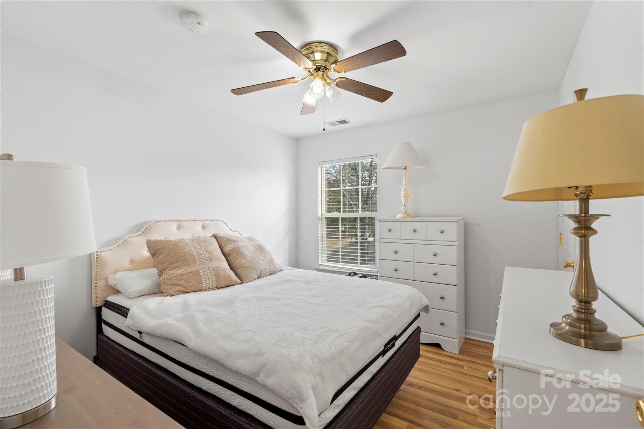 11730 Huxley Road Charlotte, NC 28277 - Photo 34 of 37 a bedroom with a bed and a table