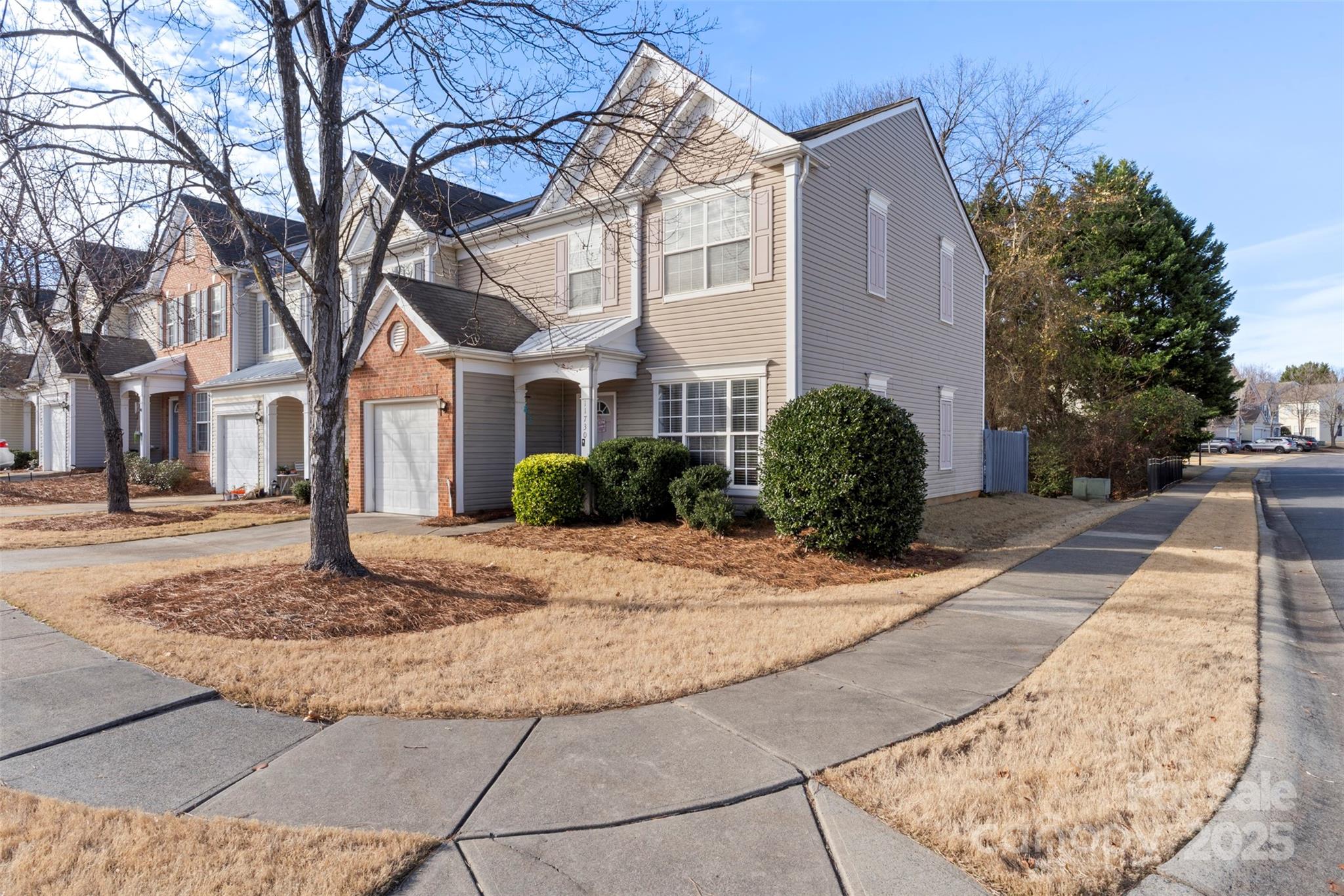 11730 Huxley Road Charlotte, NC 28277 - Photo 5 of 37 a front view of a house with garage