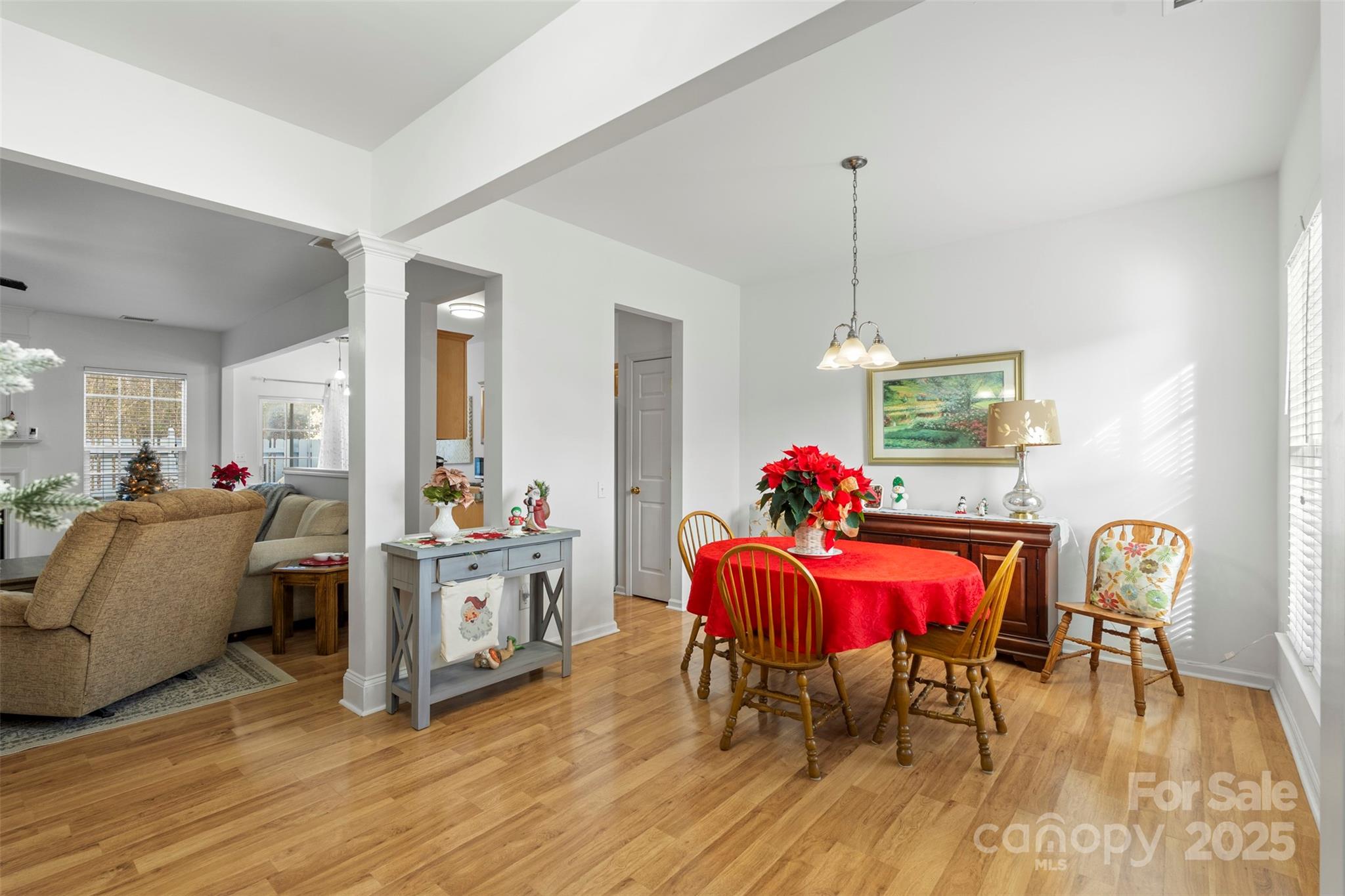 11730 Huxley Road Charlotte, NC 28277 - Photo 7 of 37 a view of a dining room with furniture and wooden floor
