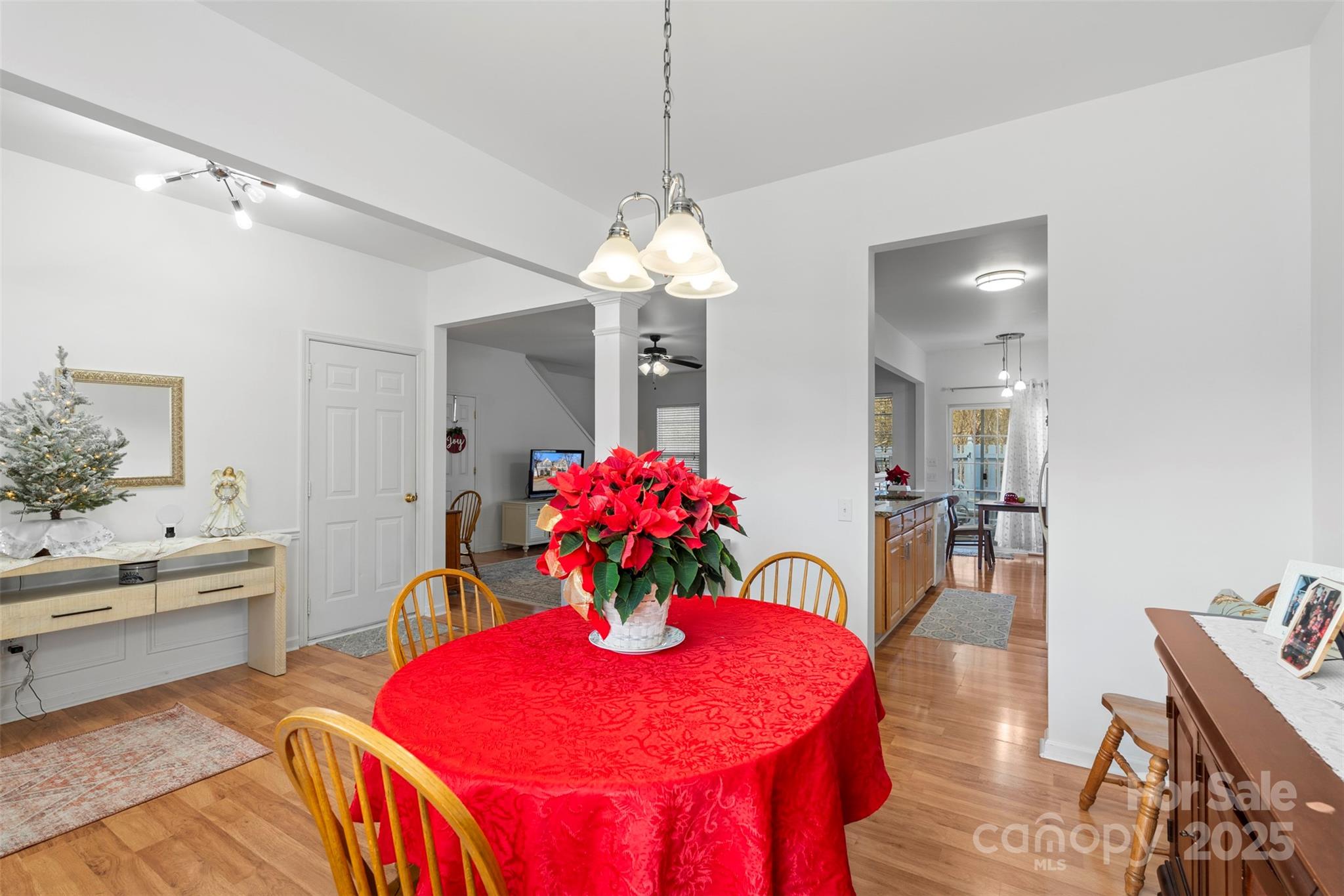 11730 Huxley Road Charlotte, NC 28277 - Photo 10 of 37 a view of a dining room with furniture and chandelier