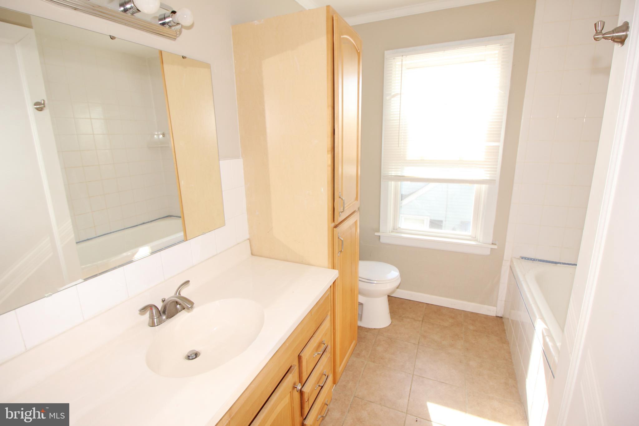 312 West Monroe Avenue Magnolia, NJ 08049 - Photo 16 of 29 a bathroom with a sink and a bathtub