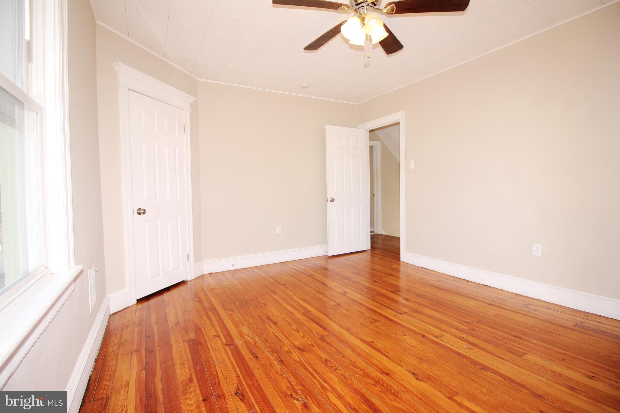 312 West Monroe Avenue Magnolia, NJ 08049 - Photo 18 of 29 a view of an empty room with wooden floor