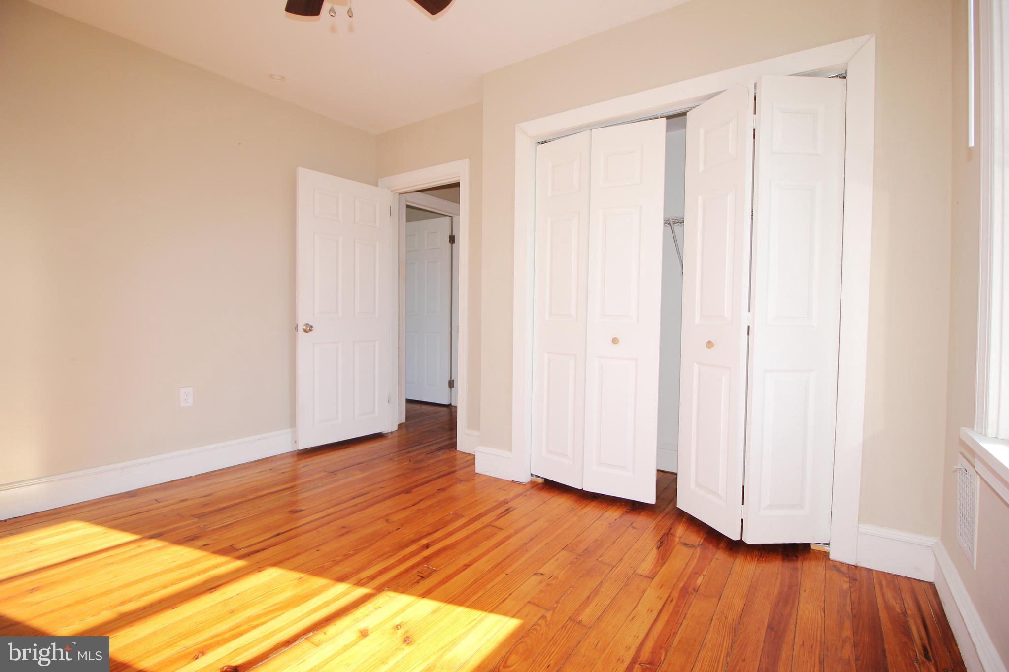 312 West Monroe Avenue Magnolia, NJ 08049 - Photo 20 of 29 a view of an empty room with wooden floor