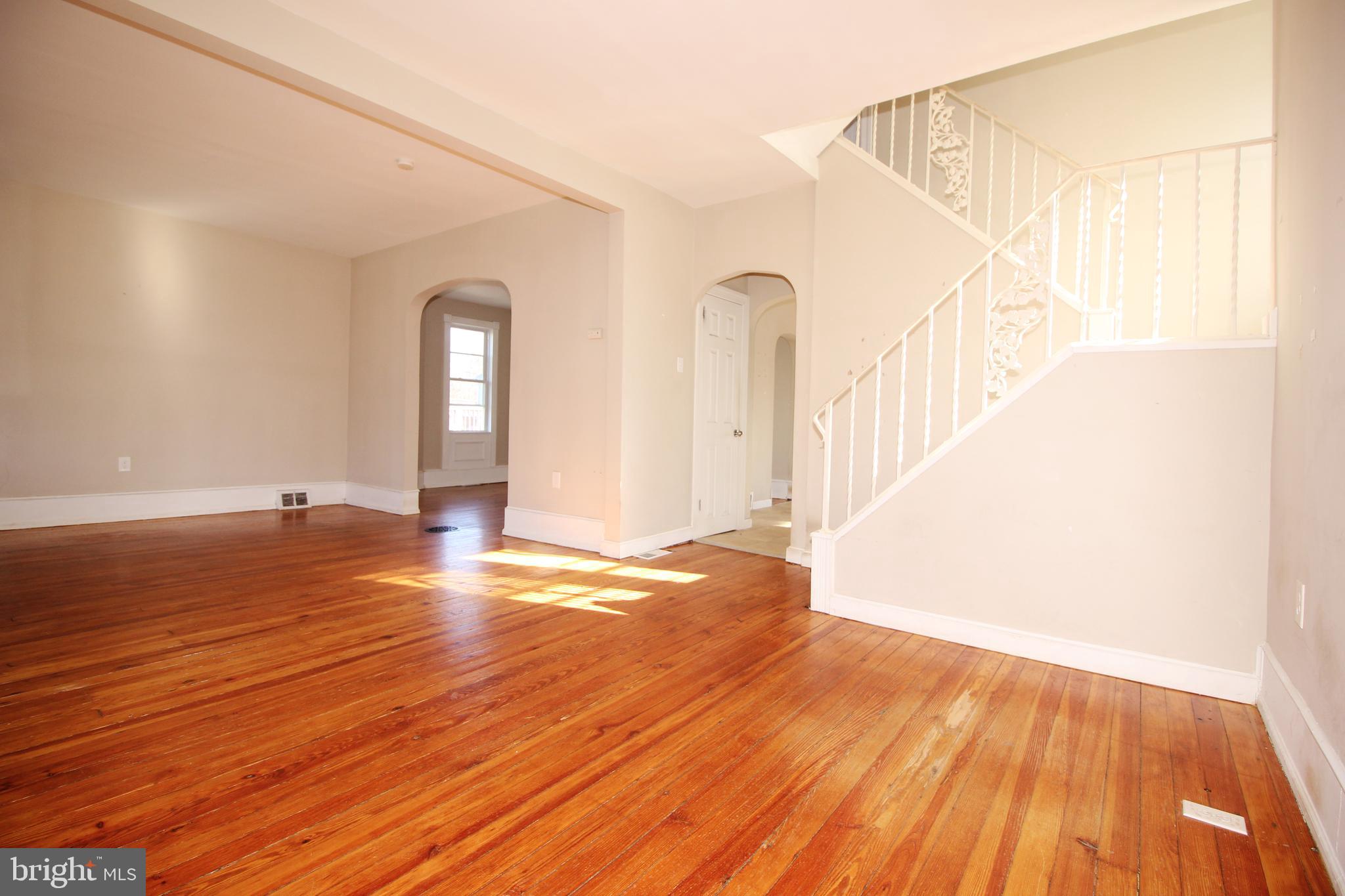312 West Monroe Avenue Magnolia, NJ 08049 - Photo 6 of 29 a view of an empty room with wooden floor and a window