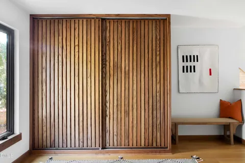 a view of a livingroom with furniture and staircase