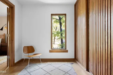a view of workspace filled with furniture and windows