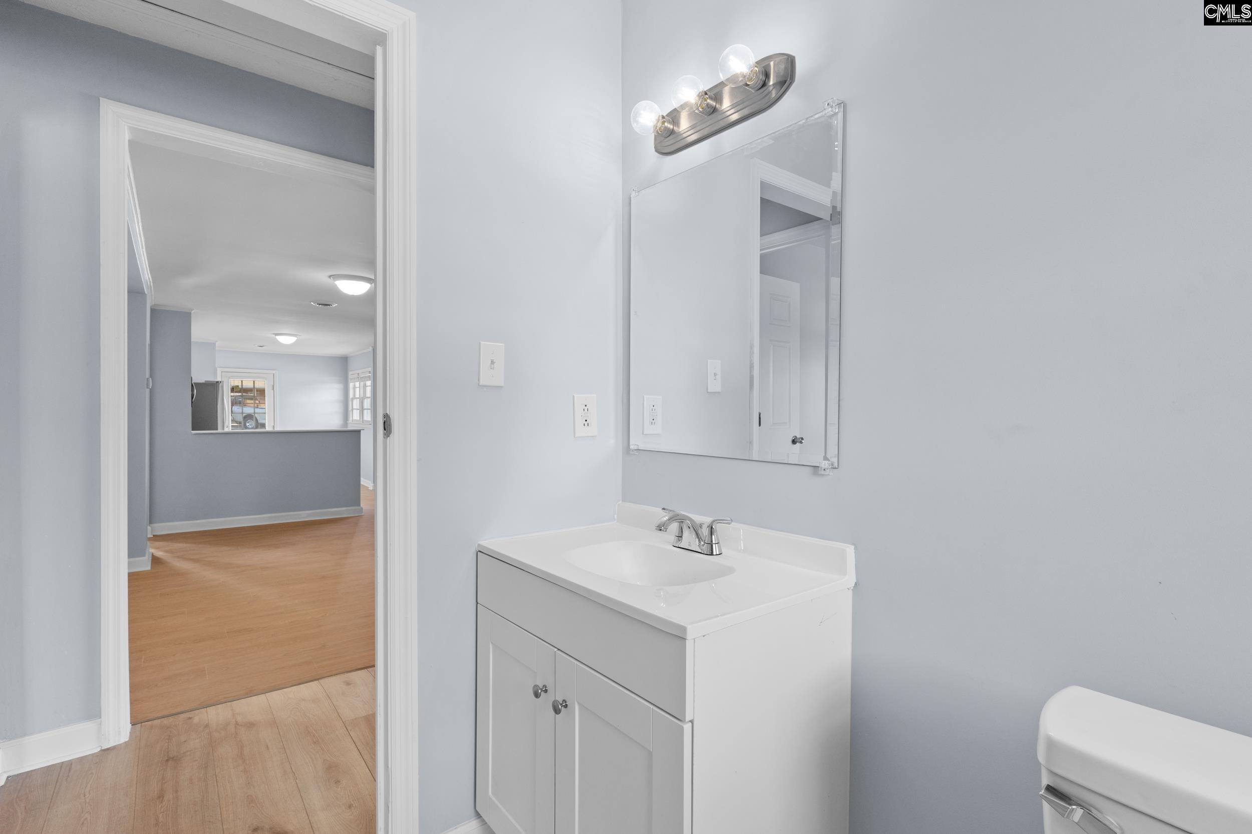 409 Wilkes Road Columbia, SC 29203 - Photo 29 of 34 a bathroom with a sink and a mirror