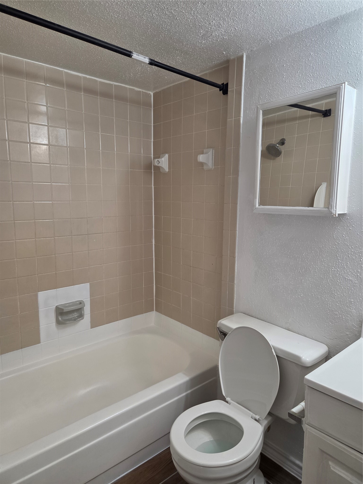 11549 South Kirkwood Road Houston, TX 77099 - Photo 6 of 7 a bathroom with a toilet a sink and bathtub