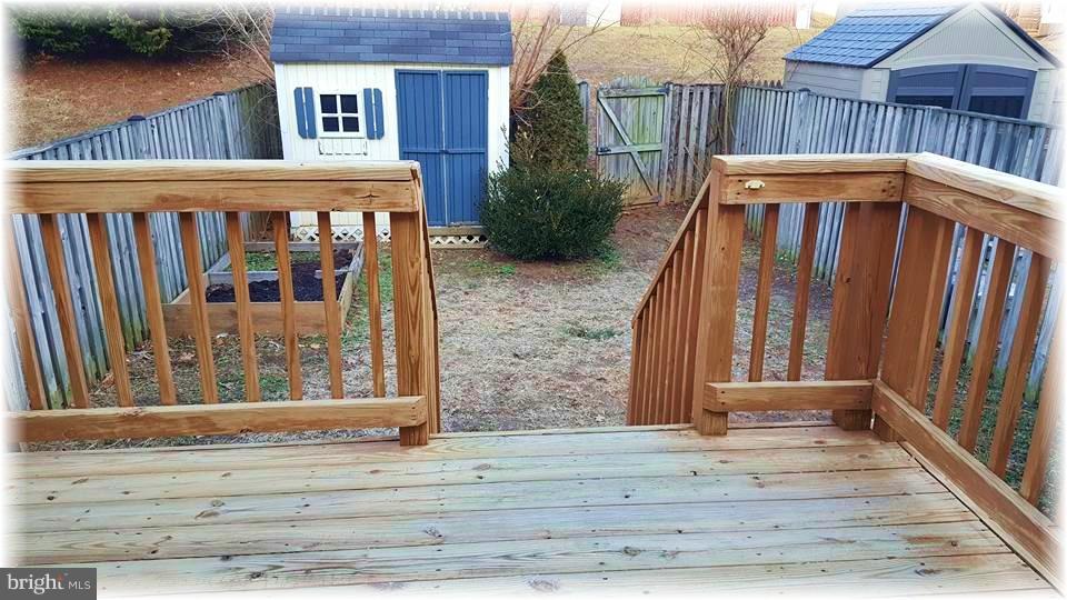 721 Shallow Ridge Court Abingdon, MD 21009 - Photo 26 of 28 Deck leads to a fenced yard with a shed.