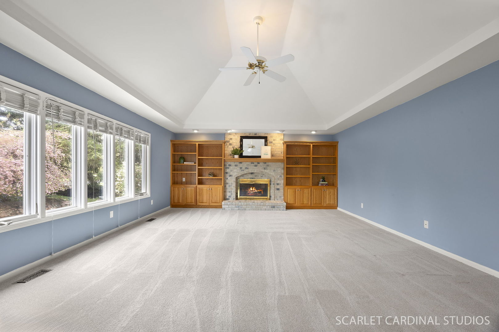 877 Elm Street Sugar Grove, IL 60554 - Photo 12 of 38 a view of an empty room with a fireplace and a window