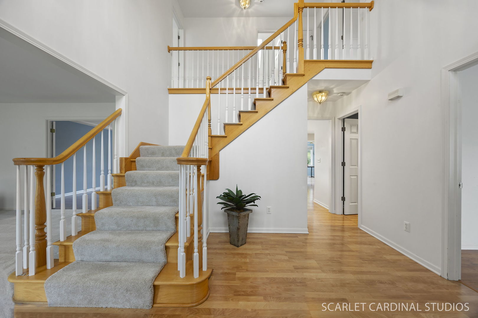 877 Elm Street Sugar Grove, IL 60554 - Photo 16 of 38 a view of staircase with lots of frames on wall and wooden floor