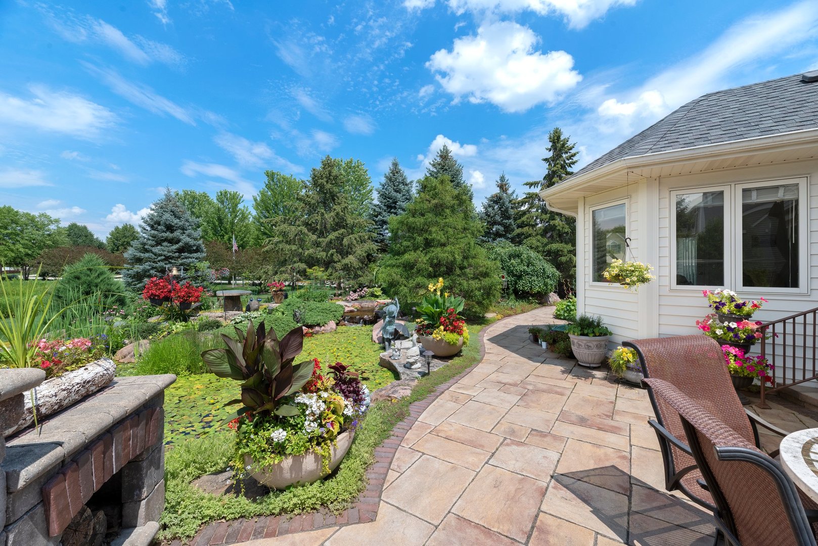 877 Elm Street Sugar Grove, IL 60554 - Photo 26 of 38 a view of a patio with table and chairs and potted plants