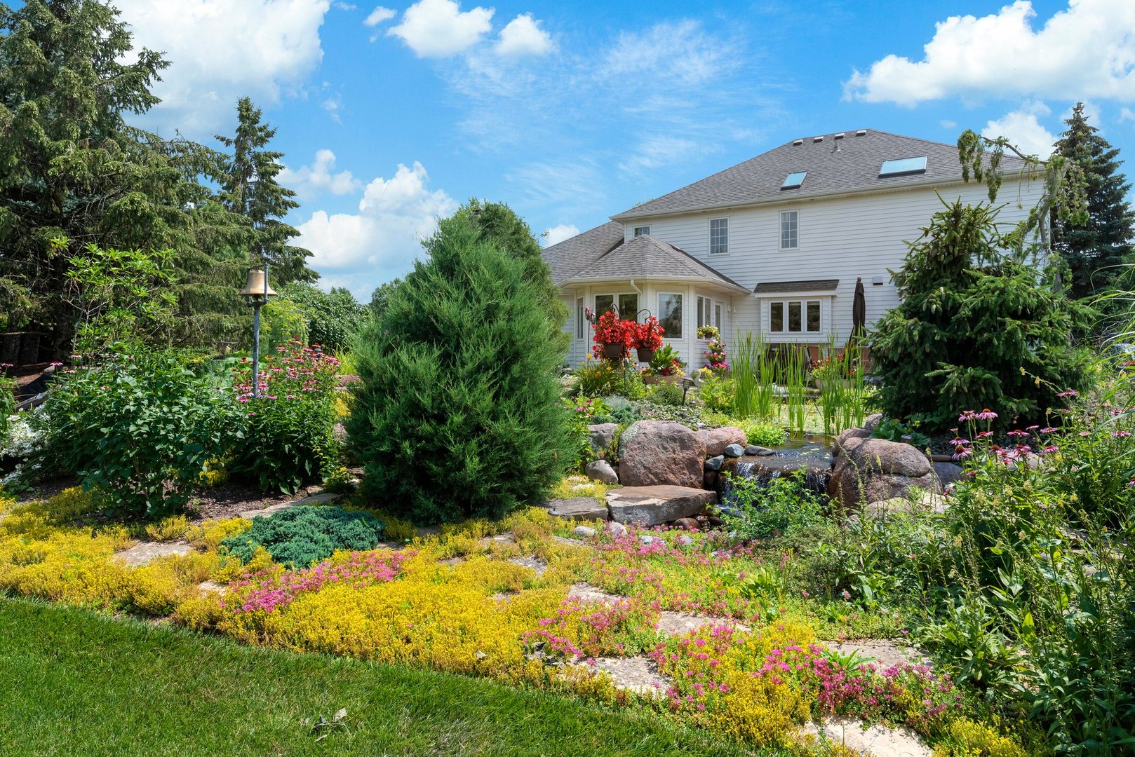 877 Elm Street Sugar Grove, IL 60554 - Photo 32 of 38 a backyard of a house with yard and outdoor seating