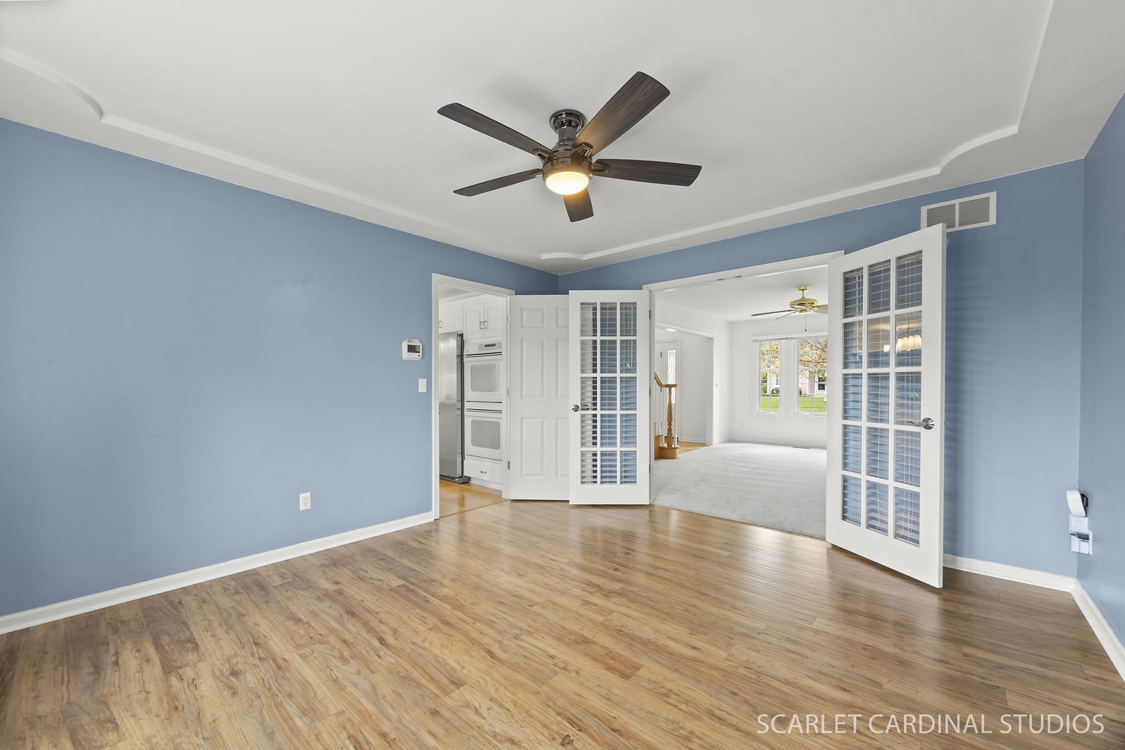 877 Elm Street Sugar Grove, IL 60554 - Photo 5 of 38 a view of a livingroom with a ceiling fan and wooden floor