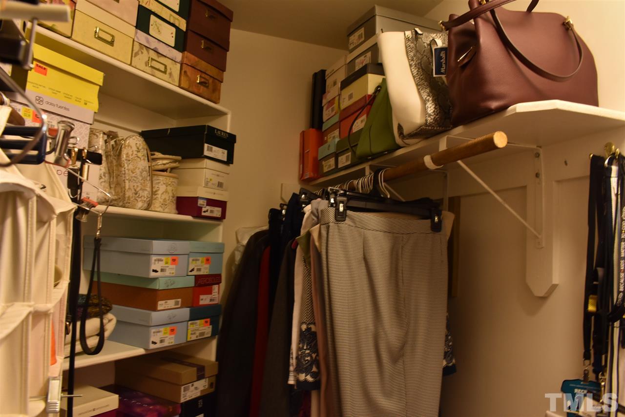 4629 Mill Rock Lane Raleigh, NC 27616 - Photo 17 of 30 a view of walk in closet with clothes and shoes