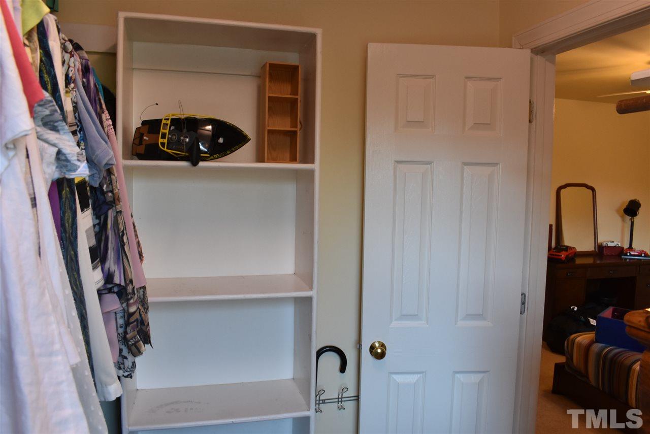 4629 Mill Rock Lane Raleigh, NC 27616 - Photo 21 of 30 a view of walk in closet with clothes and shoes