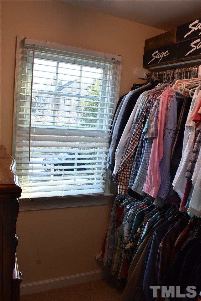 4629 Mill Rock Lane Raleigh, NC 27616 - Photo 22 of 30 a view of walk in closet with clothes and shoes