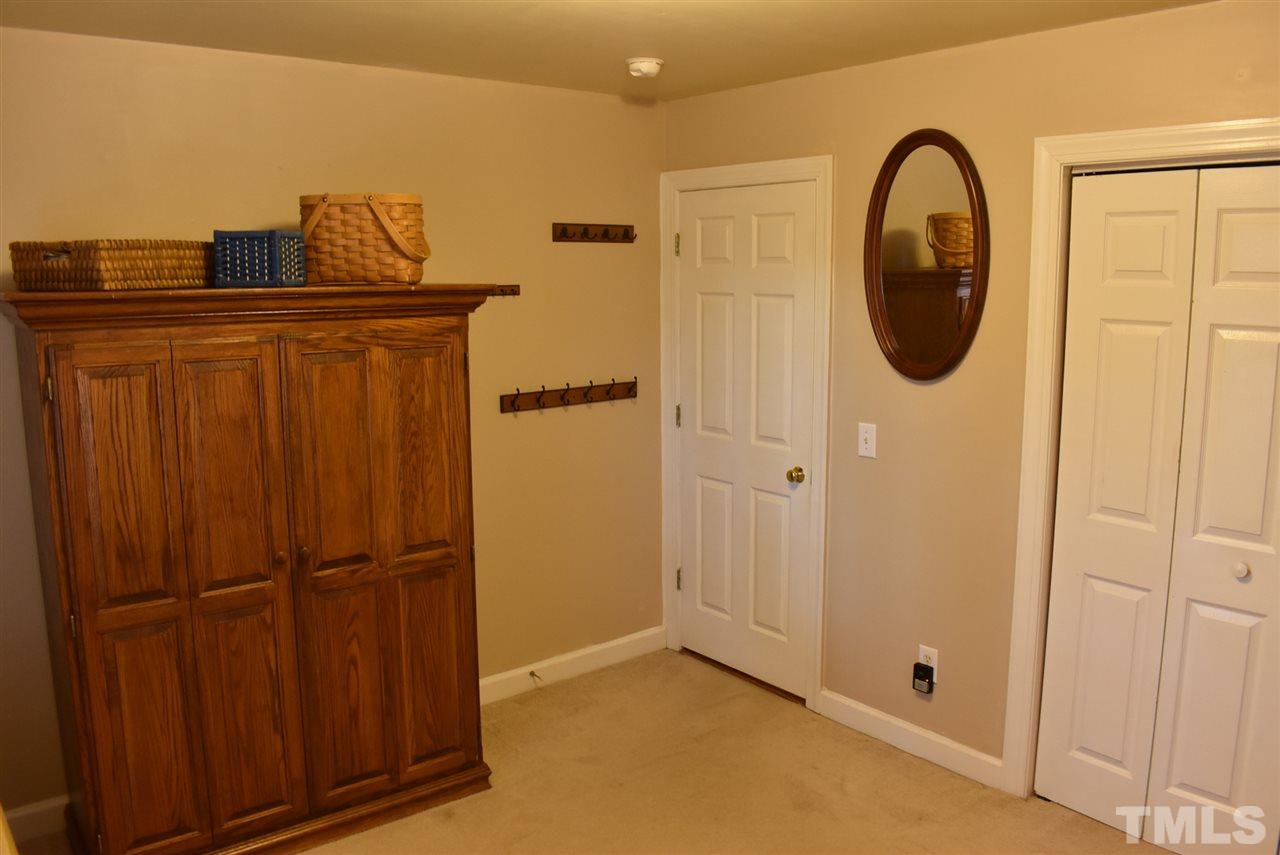 4629 Mill Rock Lane Raleigh, NC 27616 - Photo 29 of 30 a bathroom with a sink and a mirror