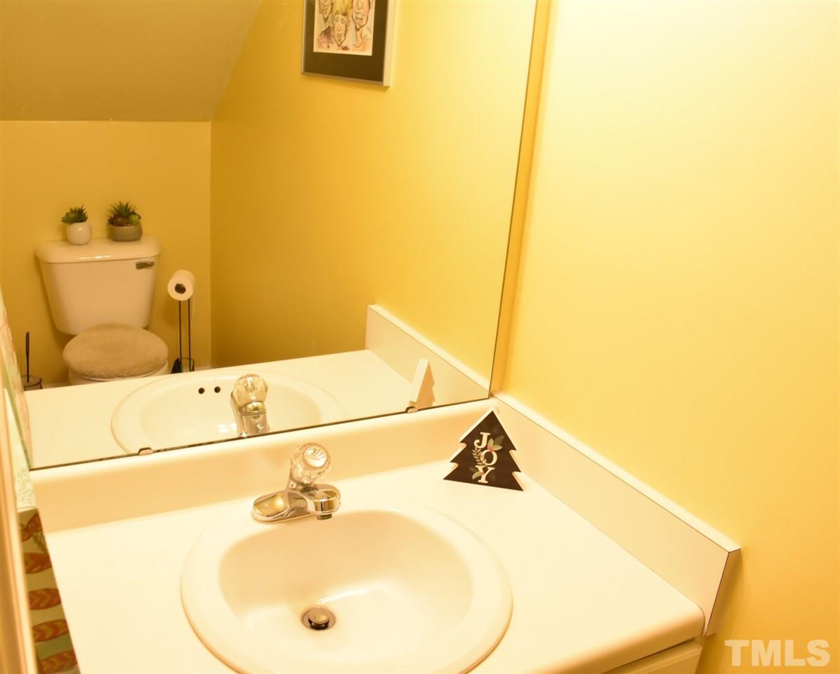 4629 Mill Rock Lane Raleigh, NC 27616 - Photo 5 of 30 a bathroom with a sink and a mirror