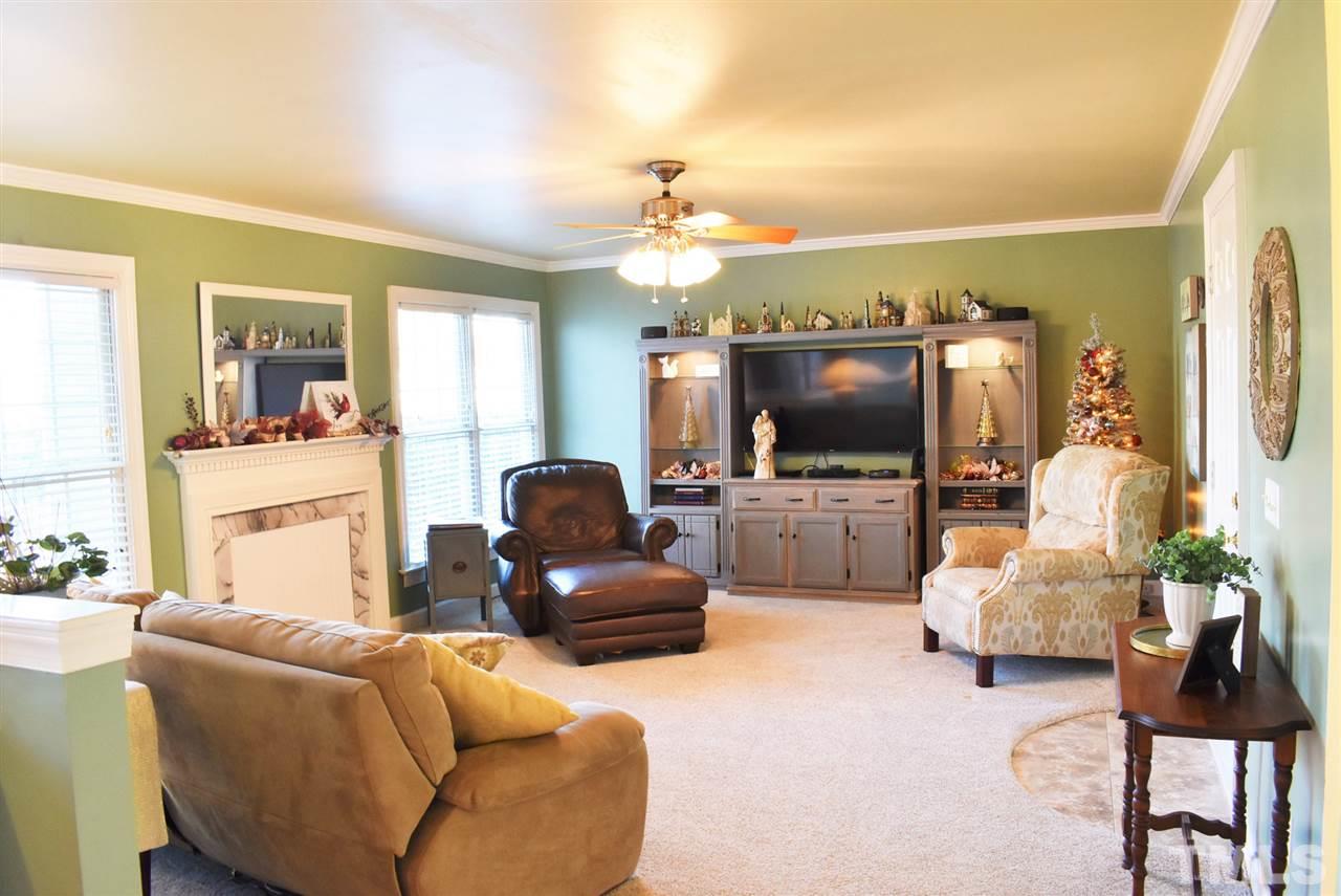 4629 Mill Rock Lane Raleigh, NC 27616 - Photo 6 of 30 a living room with furniture and a flat screen tv